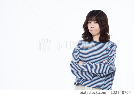 A woman in trouble with her arms folded 132248704