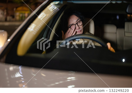 A man driving a car A man driving a car 132249220
