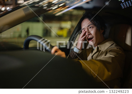 A man driving a car 132249223