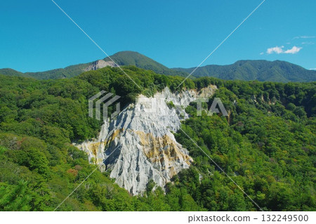 The white cliffs of Japan Canyon, surrounded by greenery against the backdrop of a clear blue sky. Ver. 2 The white cliffs of Japan Canyon, surrounded by greenery against the backdrop of a clear blue sky. Ver. 2 132249500