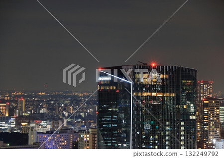 The new Takanawa Gateway City in MInato-ku Tokyo Japan aerial view shown at night with the new Marroitt Hotel 132249792