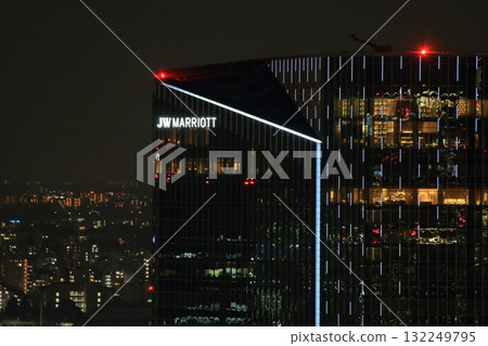 The new Takanawa Gateway City in MInato-ku Tokyo Japan aerial view shown at night with the new Marroitt Hotel 132249795