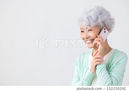 Senior woman making a phone call on smartphone Senior woman making a phone call on smartphone 132250292