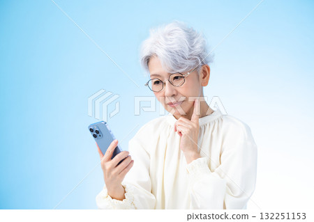 Senior female looking at a smartphone 132251153