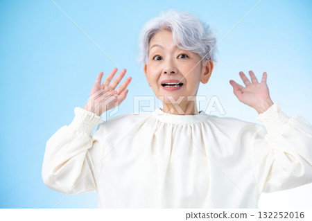Senior woman, surprised gray-haired woman 132252016