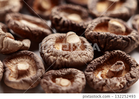 Dried shriveled edible shiitake mushrooms close up Dried shriveled edible shiitake mushrooms close up 132252493