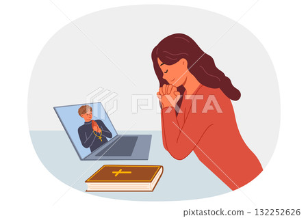 Woman prays sitting in front of laptop and watching video broadcast with priest from church Woman prays sitting in front of laptop and watching video broadcast with priest from church 132252626