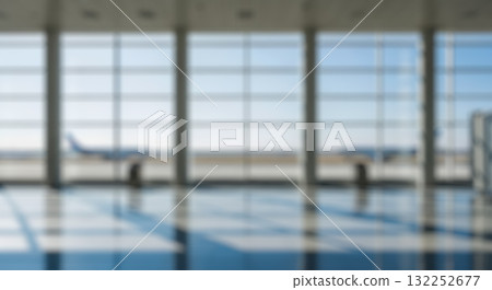 Abstract blurry airport terminal interior with architectural columns and window light creating shadows on floor for modern business or travel background Abstract blurry airport terminal interior with architectural columns and window light creating shadows on floor for modern business or travel background 132252677