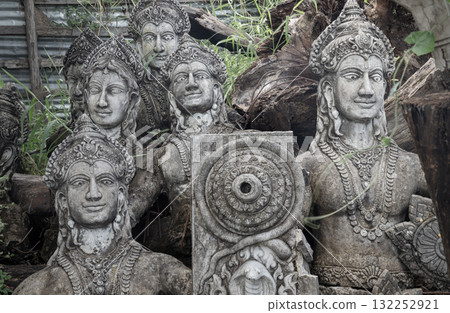 The statues style of Khmer sculpture, which often represent deities from Hindu and Buddhist mythology, are characterized by their elaborate headdresses and serene expressions. The statues style of Khmer sculpture, which often represent deities from Hindu and Buddhist mythology, are characterized by their elaborate headdresses and serene expressions. 132252921