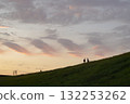 Couple watching the sunset on the hill 132253262