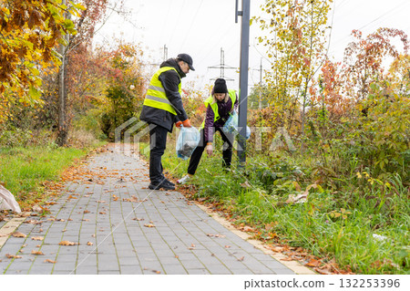 Volunteers Cleaning Up Litter Outdoors in Autumn 132253396