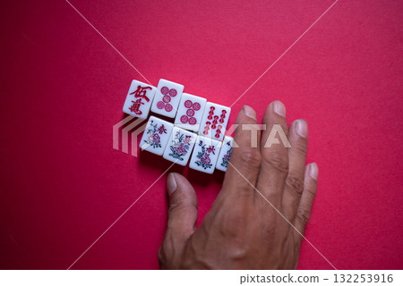 Mahjong tiles on a red background 132253916