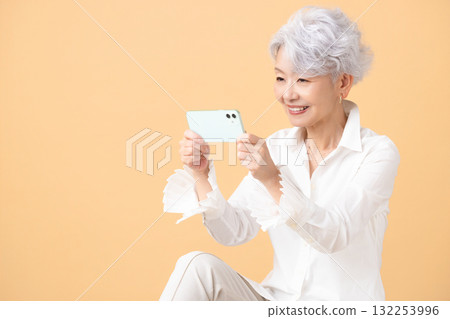Senior female looking at a smartphone 132253996