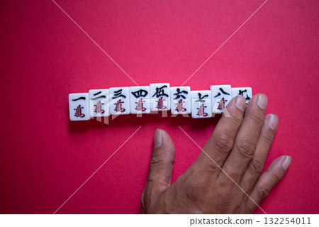 Mahjong tiles on a red background Mahjong tiles on a red background 132254011