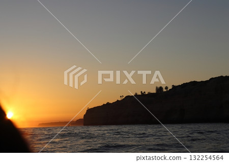 Golden Sunset Over Algarve Coastline Cliffs Golden Sunset Over Algarve Coastline Cliffs 132254564