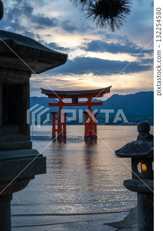 Torii of Itsukushima Shrine at sunset on Miyajima island 132254580
