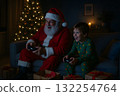 Santa Claus gaming with child at night near Christmas tree 132254764