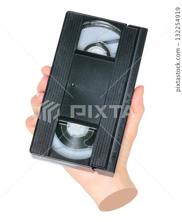 Woman hand holds a retro old analog video cassette, isolated on transparent background, retro things concept. Contemporary art Woman hand holds a retro old analog video cassette, isolated on transparent background, retro things concept. Contemporary art 132254919