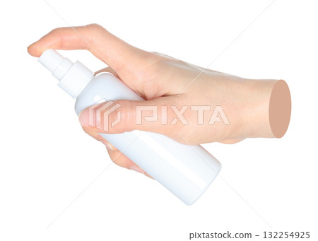 Woman hands holding a white spray bottle, isolated on transparent background close-up, template for cosmetics ads. Contemporary art 132254925