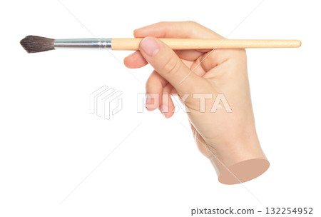 Woman hand holds paint brush, isolated on transparent background, painting and design concept. Contemporary art 132254952