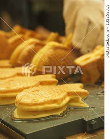 Taiyaki baked on a hot plate Taiyaki baked on a hot plate 132255315