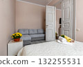 Cozy Apartment Bedroom with Sofa and Fresh Towels 132255531