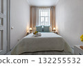 Minimalist Cozy Bedroom with Soft Lighting and Fresh Towels 132255532