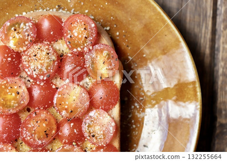 Tomato salad toast with olive oil and grated cheese Tomato salad toast with olive oil and grated cheese 132255664