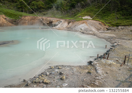 Geothermal hot spring pool in natural outdoor volcanic landscape at Oyunuma Pond, Noboribetsu, Hokkaido, Japan Geothermal hot spring pool in natural outdoor volcanic landscape at Oyunuma Pond, Noboribetsu, Hokkaido, Japan 132255884