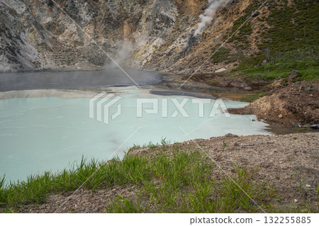 Geothermal hot spring with steam rising in volcanic landscape at Oyunuma Pond, Noboribetsu, Hokkaido, Japan Geothermal hot spring with steam rising in volcanic landscape at Oyunuma Pond, Noboribetsu, Hokkaido, Japan 132255885