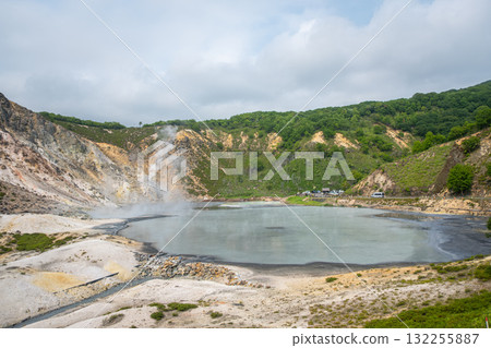 Volcanic crater lake with steam and surrounding forest landscape at Oyunuma Pond, Noboribetsu, Hokkaido, Japan Volcanic crater lake with steam and surrounding forest landscape at Oyunuma Pond, Noboribetsu, Hokkaido, Japan 132255887