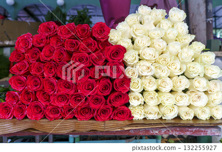 Red and White Roses on Flower Market Table 132255927