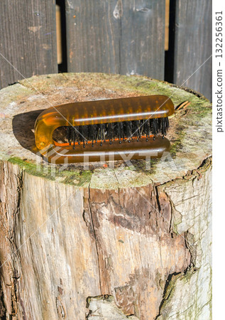 Cleaning Brush on Wooden Surface in Sunlight Household Tool 132256361