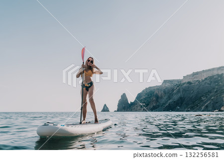 Woman Paddleboarding Ocean Coastline Summer Woman Paddleboarding Ocean Coastline Summer 132256581
