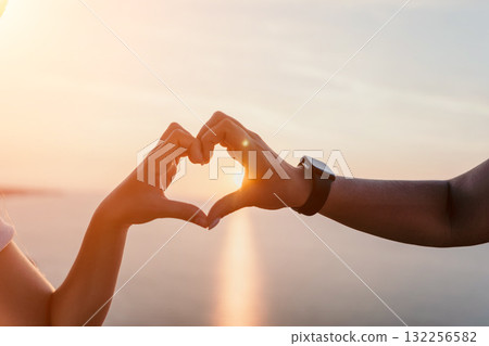 Sunset Love: Heart-Shaped Silhouette Against a Golden Sky Sunset Love: Heart-Shaped Silhouette Against a Golden Sky 132256582
