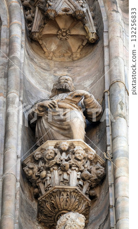 Statue of Saint on the facade of the Milan Cathedral, Duomo di Santa Maria Nascente, Milan, Lombardy, Italy Statue of Saint on the facade of the Milan Cathedral, Duomo di Santa Maria Nascente, Milan, Lombardy, Italy 132256833