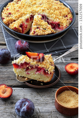 Crumb topped Plum Pie in a baking dish 132257009