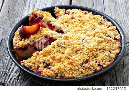 Crumb topped Plum Pie in a baking dish Crumb topped Plum Pie in a baking dish 132257015