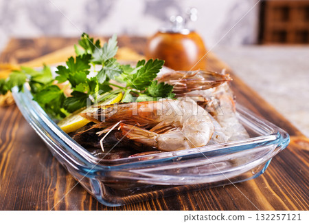 Uncooked Raw peeled tiger white shrimp prawn. Uncooked Raw peeled tiger white shrimp prawn. 132257121