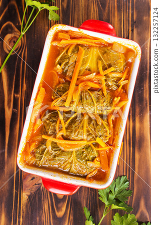 Meatballs with cabbage (golubci) baked in tomato sauce Meatballs with cabbage (golubci) baked in tomato sauce 132257124