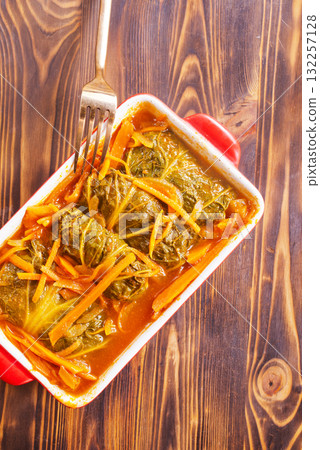 Meatballs with cabbage (golubci) baked in tomato sauce Meatballs with cabbage (golubci) baked in tomato sauce 132257128
