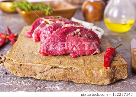Raw meat on a table with spices 132257143