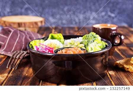 Black Bowl with Healthy salad 132257149