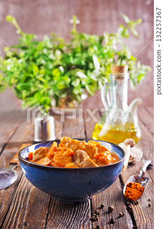 Chicken curry in dark blue bowl 132257367