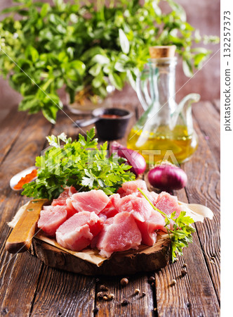 raw meat with spice on wooden board 132257373