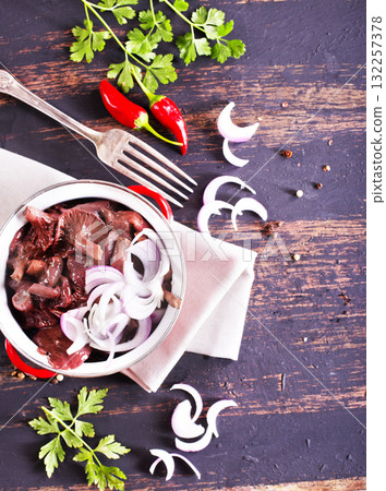 Gomphidius glutinosus,commonly known as the slimy spike-cap, mushrooms with onion in bowl Gomphidius glutinosus,commonly known as the slimy spike-cap, mushrooms with onion in bowl 132257378