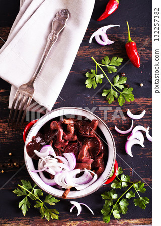 Gomphidius glutinosus,commonly known as the slimy spike-cap, mushrooms with onion in bowl Gomphidius glutinosus,commonly known as the slimy spike-cap, mushrooms with onion in bowl 132257382