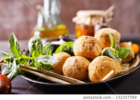 Overhead image of arabic snack falafel in the form of chickpea balls with spices. Overhead image of arabic snack falafel in the form of chickpea balls with spices. 132257399