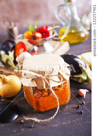 Dish with squash caviar dark background. Squash spread, zucchini caviar and ingredients. Healthy food. Top view Dish with squash caviar dark background. Squash spread, zucchini caviar and ingredients. Healthy food. Top view 132257401