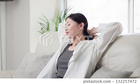 Asian woman stretching on the sofa 132257472